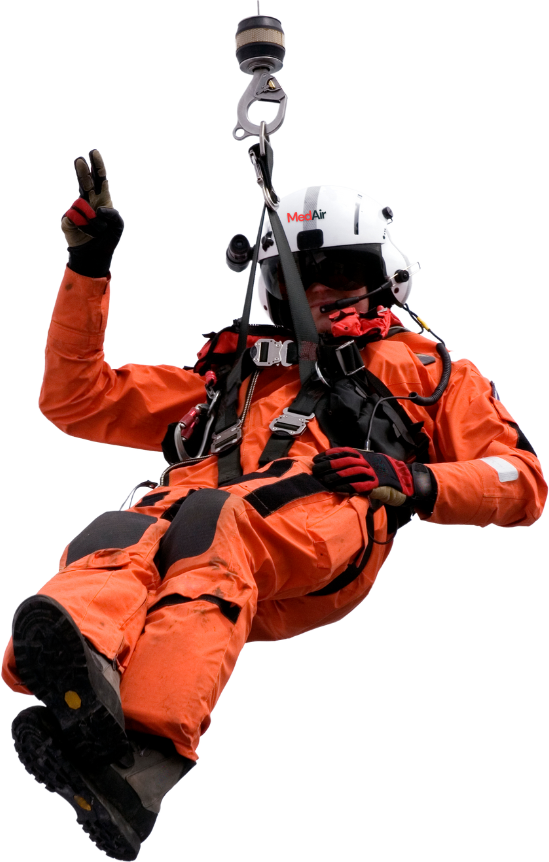 MedAir rescuer being lowered from a helicopter
